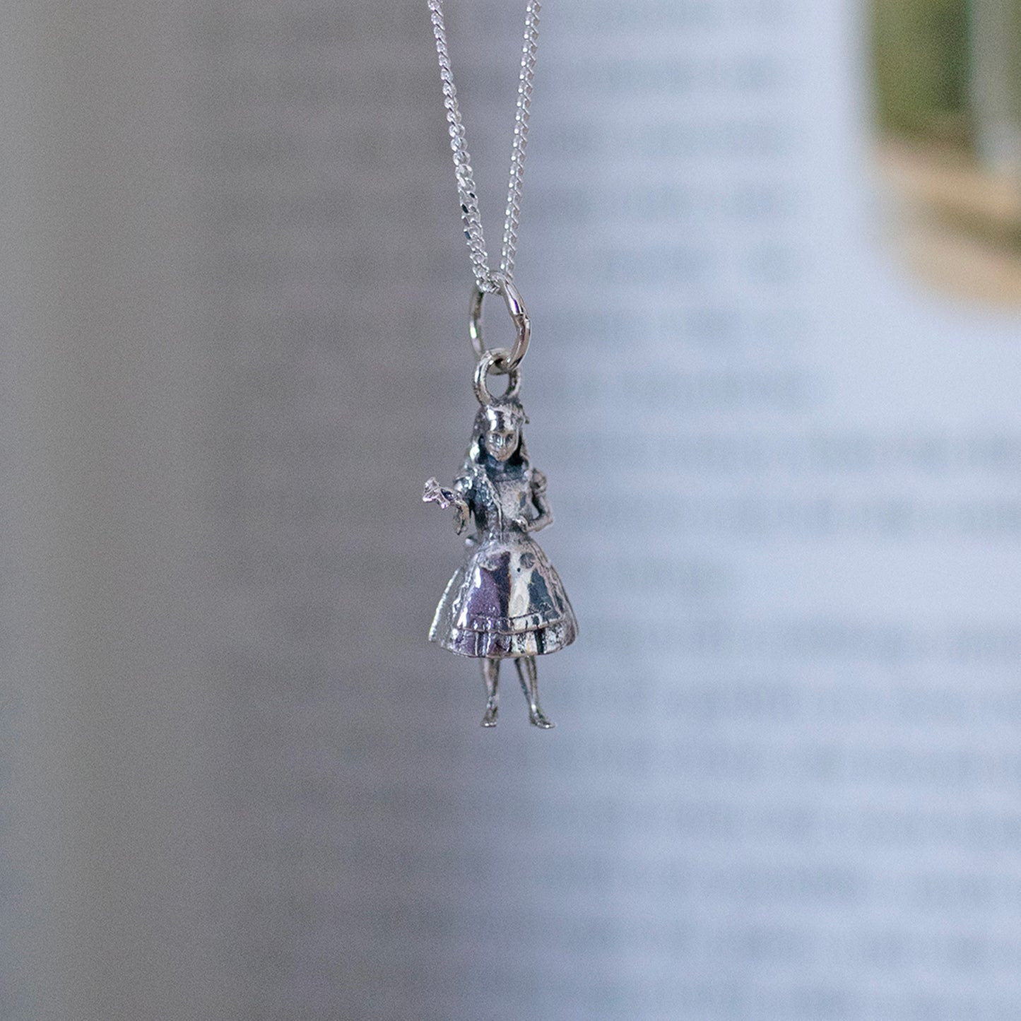 Alice's Adventures in Wonderland book and Alice Charm Necklace