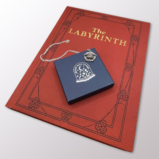 Books with Charm | Jim Henson's Labyrinth Movie A4 hardback illustrated book and Sterling Silver Ludo Charm Necklace. Book Gift Sets from £99.95